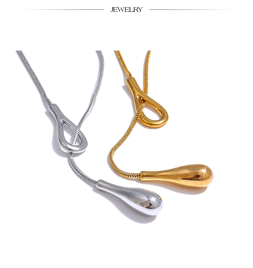 Skulpturale Tropfen - Halskette in Gold - und Silberoptik