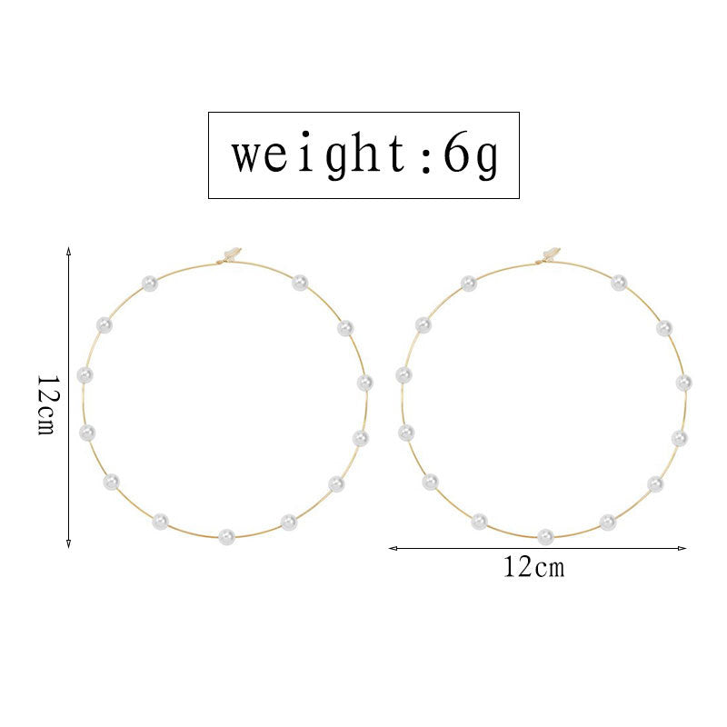 Grosse Creolen mit Kugeldetails in Silberoptik